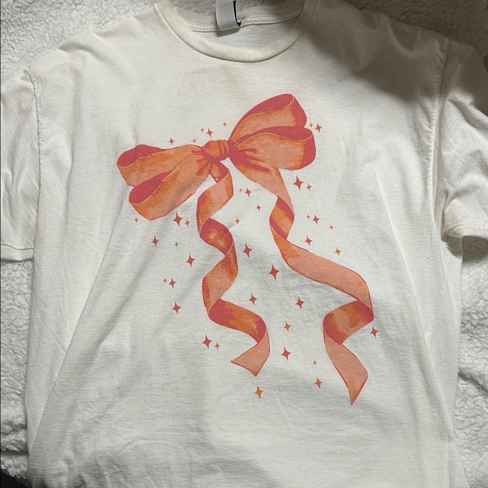 White T-Shirt with Orange Bow Design